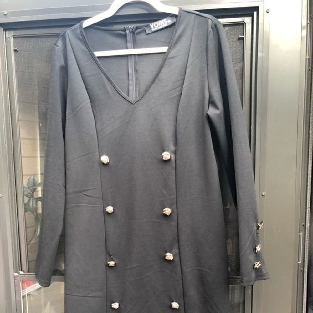 Black long sleeve button dress.